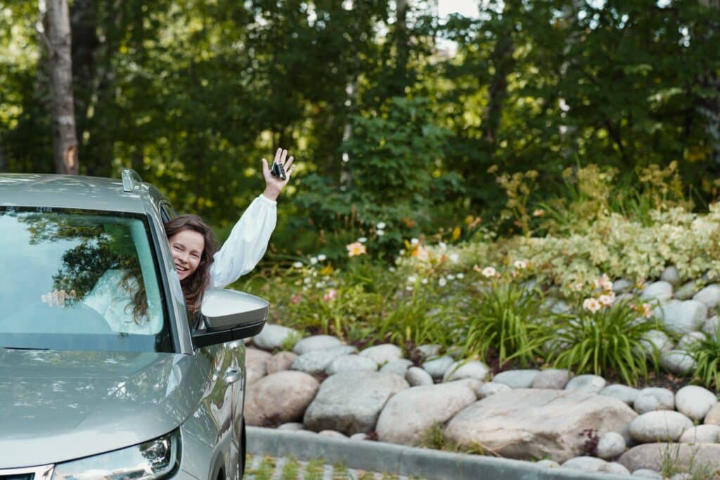 happy-smiling-adult-woman-driver-holds-the-keys-to-2023-11-27-04-55-00-utc